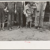 Feet and clothes of the Earl Taylor family near Black River Falls, Wisconsin