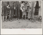 Feet and clothes of the Earl Taylor family near Black River Falls, Wisconsin
