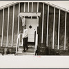 Man leaving infirmary in resettlement camp on land use project near Black River Falls, Wisconsin