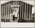 Man leaving infirmary in resettlement camp on land use project near Black River Falls, Wisconsin