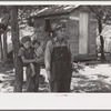 Alonzo Heath with two of his children. He is a farmer near Black River Falls, Wisconsin