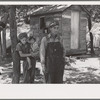 Alonzo Heath with two of his children. He is a farmer near Black River Falls, Wisconsin