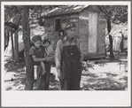 Alonzo Heath with two of his children. He is a farmer near Black River Falls, Wisconsin