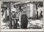 Alonzo Heath with two of his children. He is a farmer near Black River Falls, Wisconsin