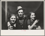 Lumberjack and two "attendants" in saloon of Craigville, Minnesota