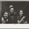 Lumberjack and two "attendants" in saloon of Craigville, Minnesota