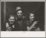 Lumberjack and two "attendants" in saloon of Craigville, Minnesota