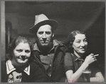 Lumberjack and two "attendants" in saloon of Craigville, Minnesota