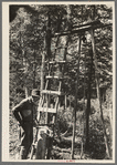 William Besson and his drilling rig. Near Winton, Minnesota