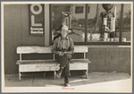 Man sitting in front of store, Craigville, Minnesota