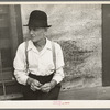Man sitting on bench, Craigville, Minnesota