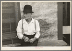Man sitting on bench, Craigville, Minnesota