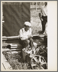 Man at auction sale, Sparlin farm, Orth, Minnesota