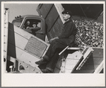 Picking up and piling sugar beets before topping them near East Grand Forks, Minnesota
