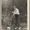 Dipping water from shallow well on farm near Northome, Minnesota