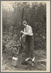 Dipping water from shallow well on farm near Northome, Minnesota