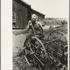 FSA (Farm Security Administration) client sitting on cultivator, Southeast Missouri Farms