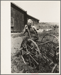 FSA (Farm Security Administration) client sitting on cultivator, Southeast Missouri Farms