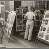 Children looking at posters in front of movie, Saturday, Steele, Missouri
