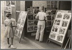 Children looking at posters in front of movie, Saturday, Steele, Missouri