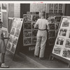 Children looking at posters in front of movie, Saturday, Steele, Missouri
