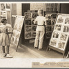 Children looking at posters in front of movie, Saturday, Steele, Missouri