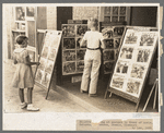 Children looking at posters in front of movie, Saturday, Steele, Missouri