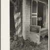 Barber pole on tree and sign, Kenner, Louisiana