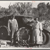 Migrant cane chair maker and wife in front of their automobile home, near Paradis, Louisiana