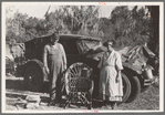 Migrant cane chair maker and wife in front of their automobile home, near Paradis, Louisiana