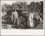 Migrant cane chair maker and wife in front of their automobile home, near Paradis, Louisiana