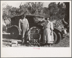 Migrant cane chair maker and wife in front of their automobile home, near Paradis, Louisiana