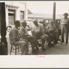 Group of Italians talking, Decatur Street, New Orleans, Louisiana