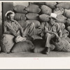 Farmers sitting on bags of rice, state mill, Abbeville, Louisiana