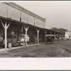 Unloading platform of state mill, Abbeville, Louisiana, with farmers' trucks waiting to be unloaded