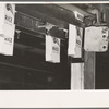 Containers for rice in conveyor, state mill, Abbeville, Louisiana