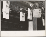 Containers for rice in conveyor, state mill, Abbeville, Louisiana