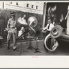 Members of Southwestern University band unloading instruments from truck, National Rice Festival, Crowley, Louisiana