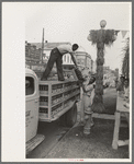 Unloading bottled drinks from truck, National Rice Festival, Crowley, Louisiana