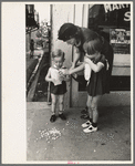 Mother with two children with popcorn, National Rice Festival, Crowley, Louisiana