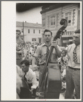 Bass viol player, Cajun band contest, National Rice Festival, Crowley, Louisiana