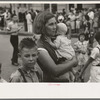 Farm mother with children in town during the National Rice Festival, Crowley, Louisiana