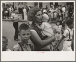 Farm mother with children in town during the National Rice Festival, Crowley, Louisiana