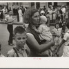 Farm mother with children in town during the National Rice Festival, Crowley, Louisiana