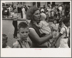 Farm mother with children in town during the National Rice Festival, Crowley, Louisiana