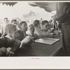 Boys standing at counter of concession, state fair, Donaldsonville, Louisiana