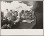 Boys standing at counter of concession, state fair, Donaldsonville, Louisiana