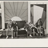 Group of tired people resting at state fair, Donaldsonville, Louisiana
