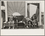 Group of tired people resting at state fair, Donaldsonville, Louisiana