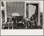 Group of tired people resting at state fair, Donaldsonville, Louisiana